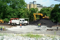 Hi-rail truck passing the remaining coal pile